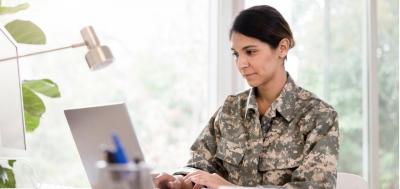 Female soldier works remote from home office  ©iStockphoto.com/SDI Productions
